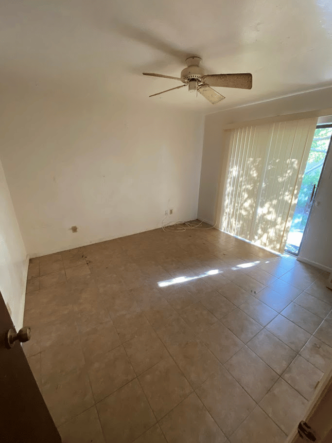 Bedroom interior cleared after residential cleanout service