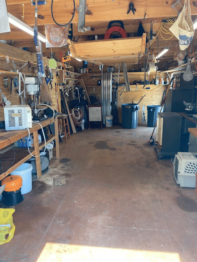Clean and organized garage workshop with tools stored neatly after cleanout